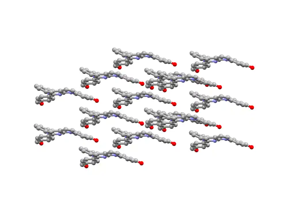 Animated visualisation of a molecular crystal: repeated elongated molecules, shown as grey,&nbsp;blue&nbsp;and red spheres, arrange into an ordered lattice pattern, illustrating how molecules pack together in a solid structure.&nbsp;